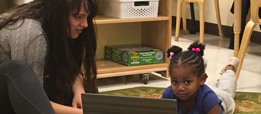 Student observing a child at The Early Learning Center