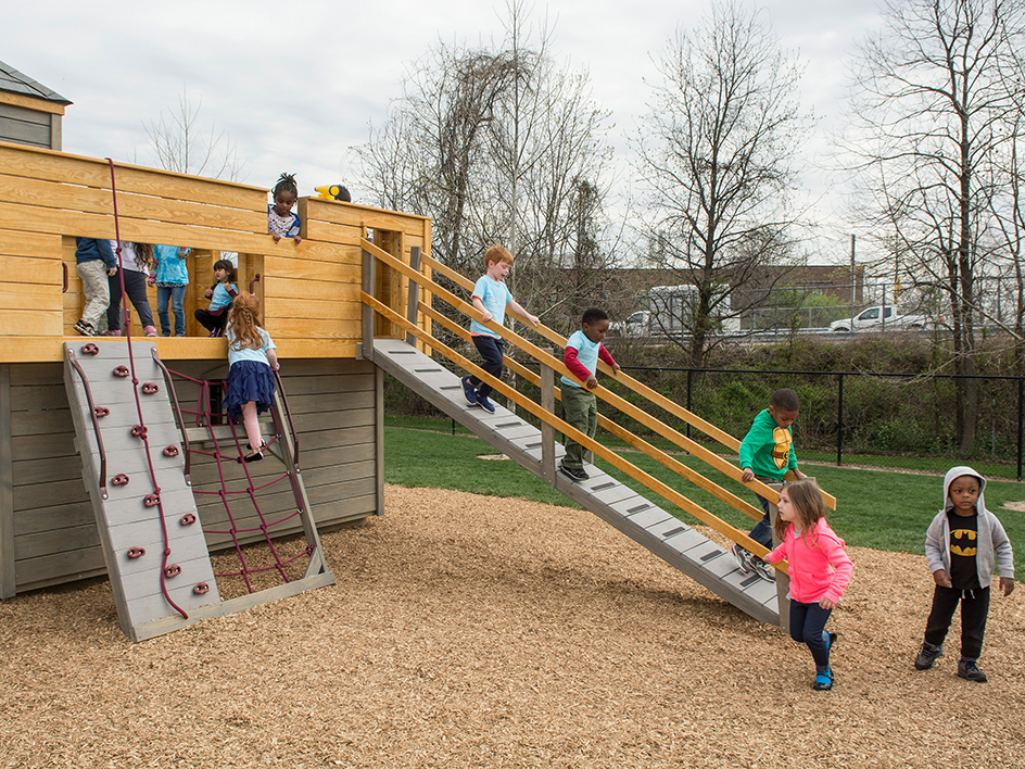 Students climbing playground at the Early Learning Center