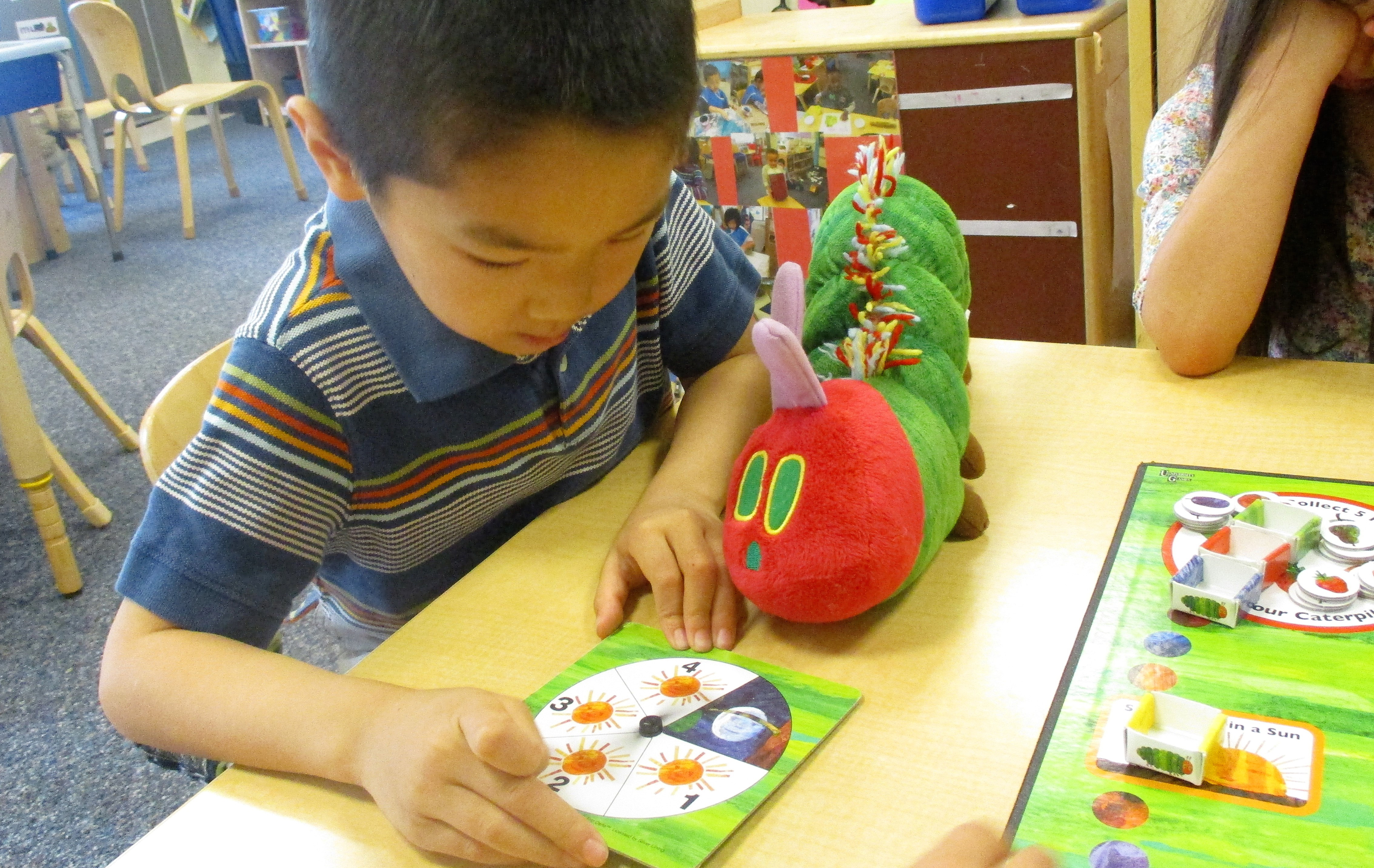 Student plays educational game in classroom at the Early Learning Center