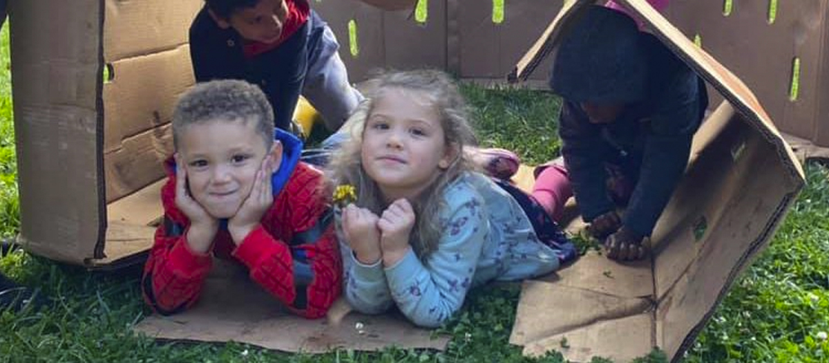 Two preschool children playing outside at the Early Learning Center