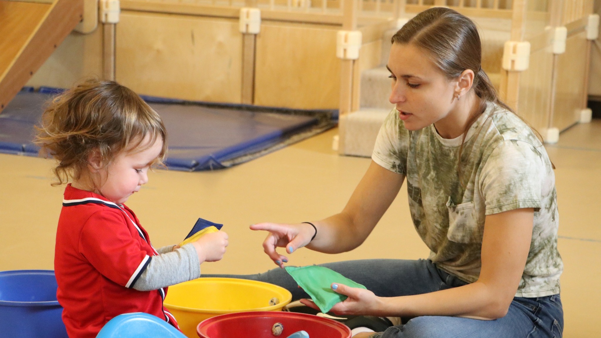 Two children outside at the University of Delaware Early Learning Center